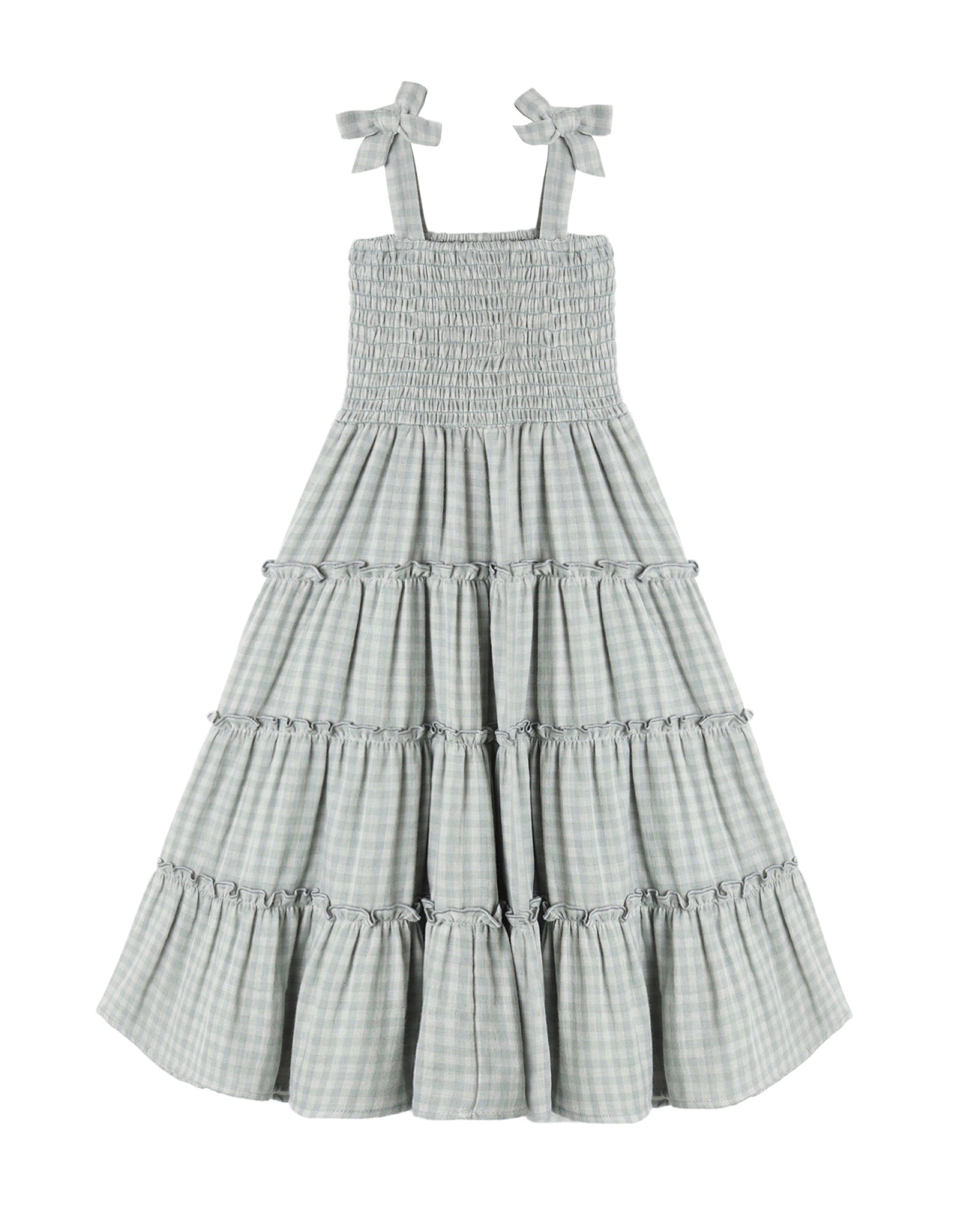 Green gingham checkered dress with tiered skirt and bow straps on a white background