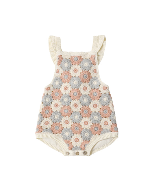 Baby romper with floral pattern on a white background