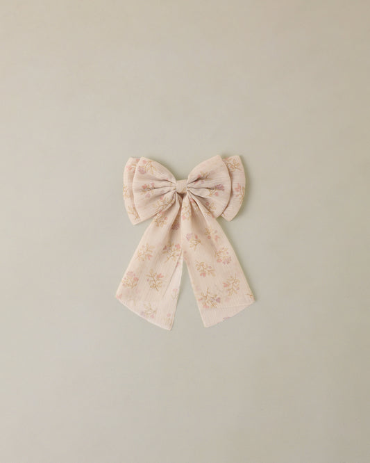 Floral bow on a light green background