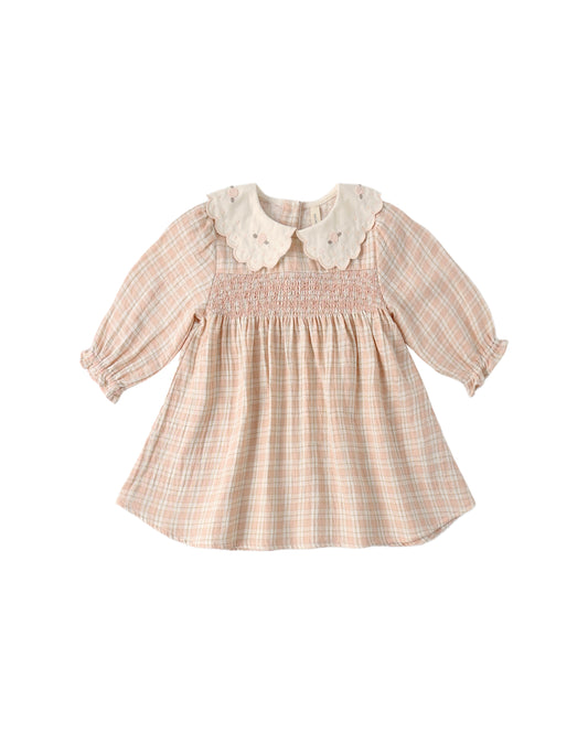 Pink checkered dress with white collar on a white background