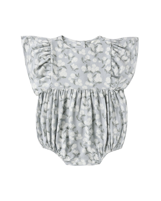Floral-patterned baby romper on a white background