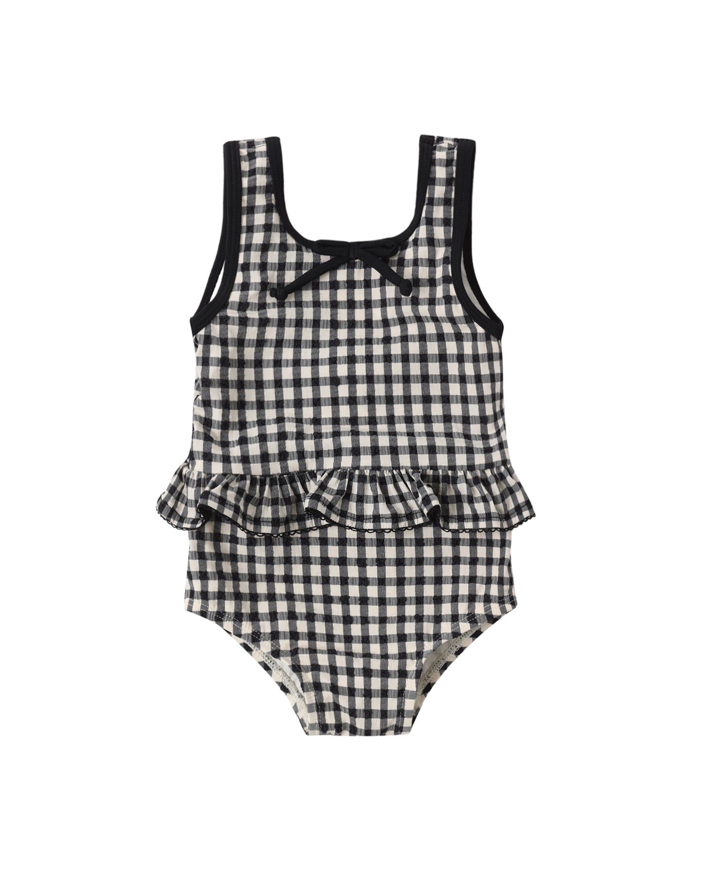 Black and white checkered children's swimsuit with ruffled details on a white background