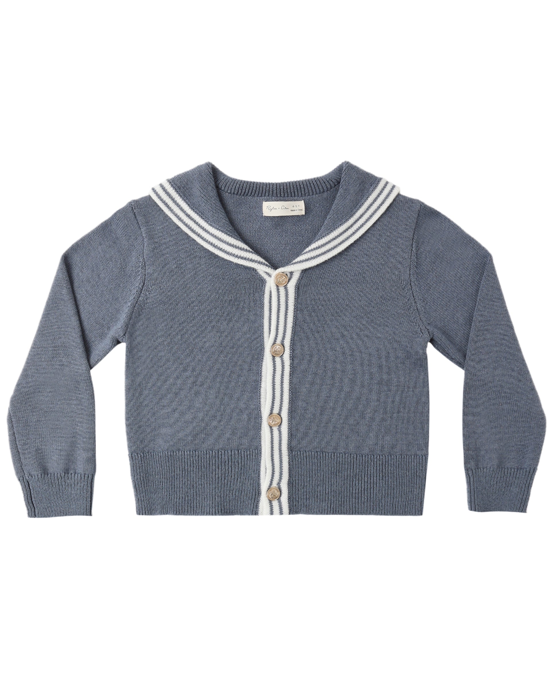 Blue knitted cardigan with white trim on a white background