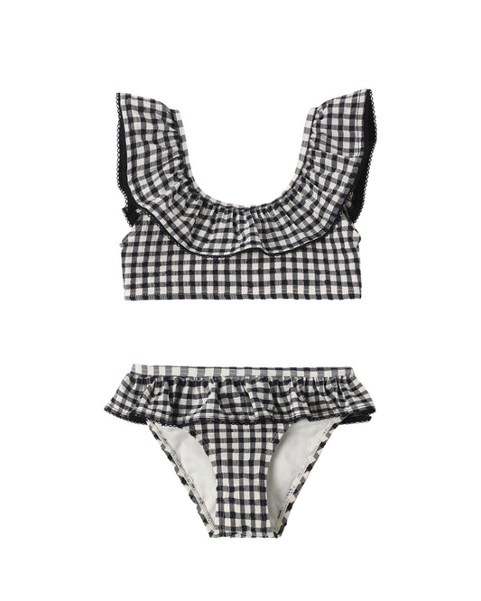 Black and white checkered children's bikini set on a white background