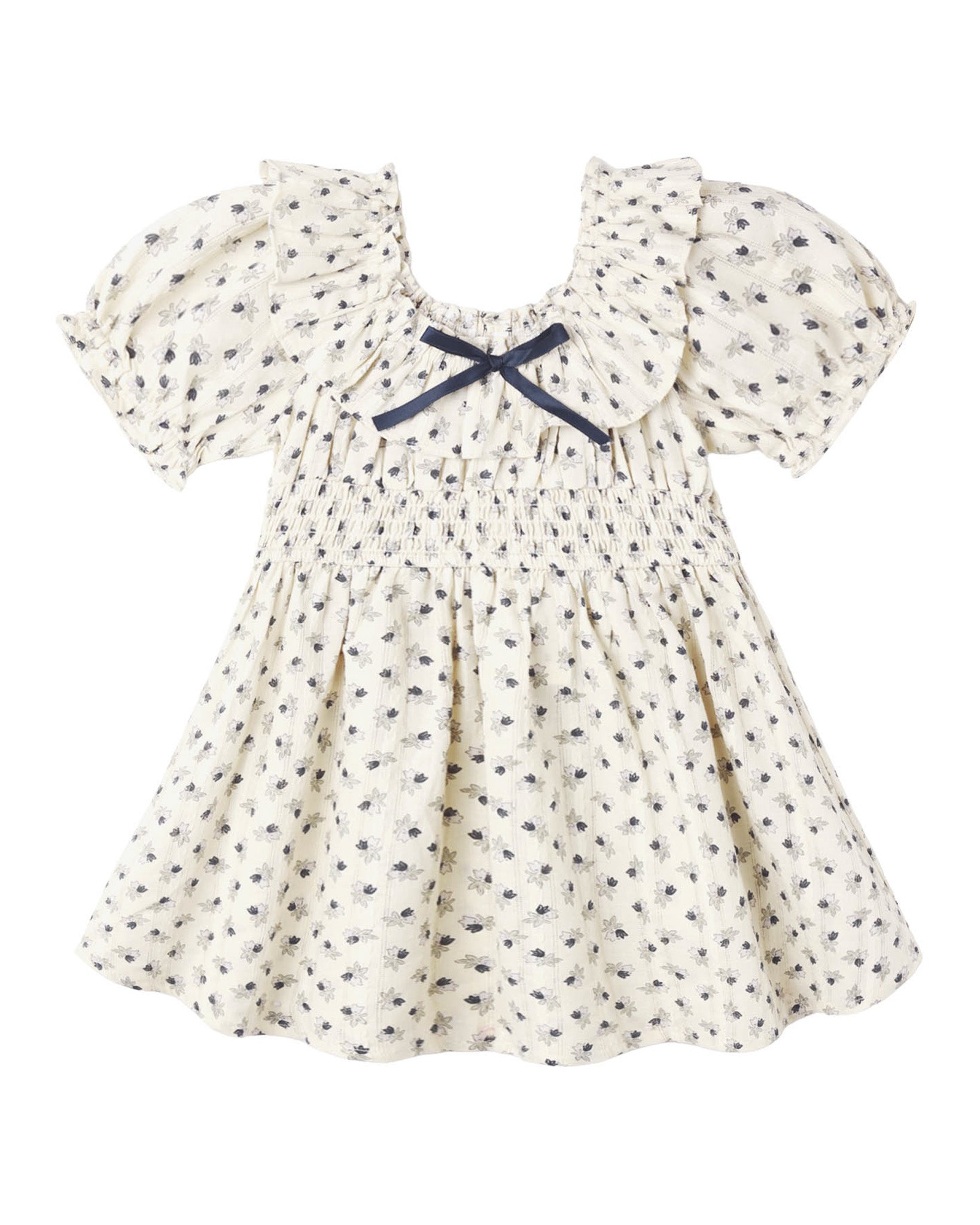 Ivory child's dress with ruffle collar, blue ribbon on collar and ruching at waist with an allover blue floral print