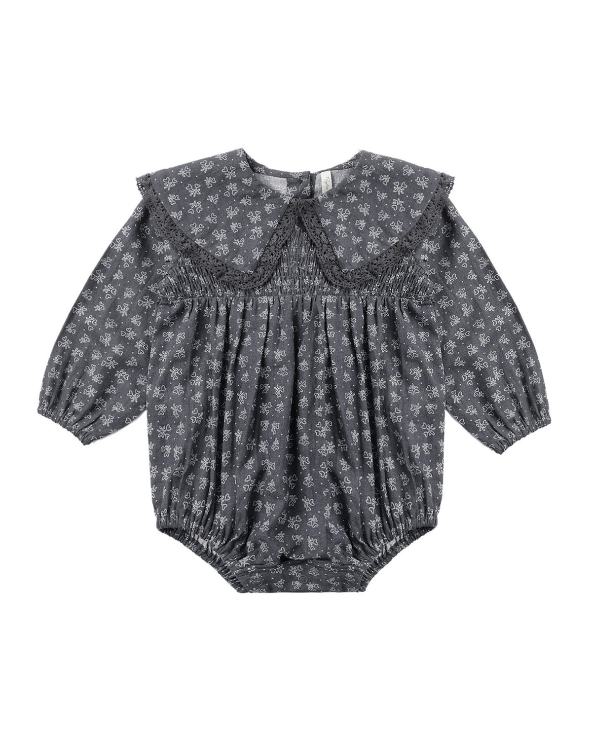 Baby romper with collar and dark blue/grey floral pattern on a white background