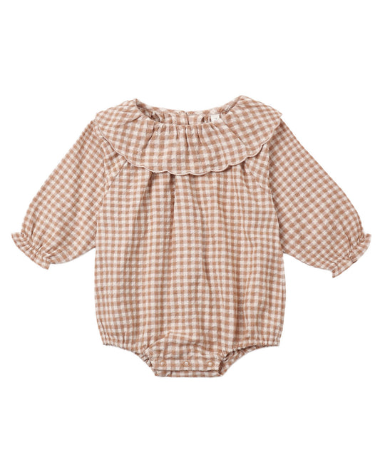 Long sleeve baby romper in tan/coral gingham with ruffle collar.