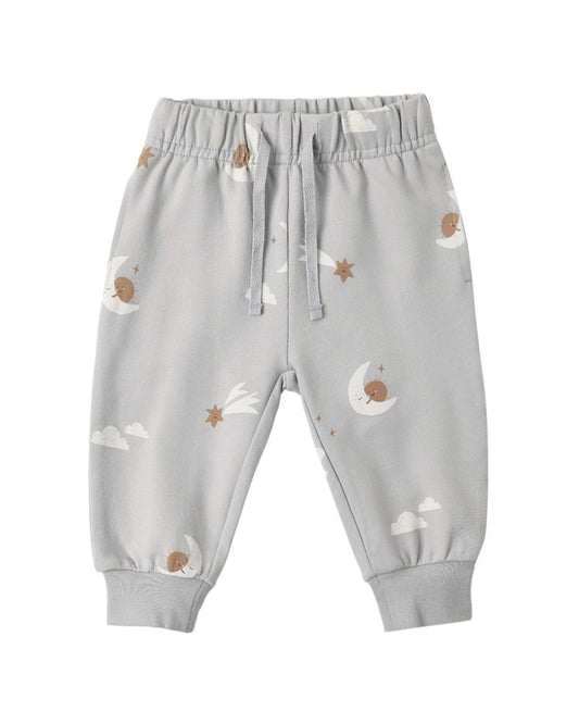 Gray baby pants with moon and star patterns on a white background