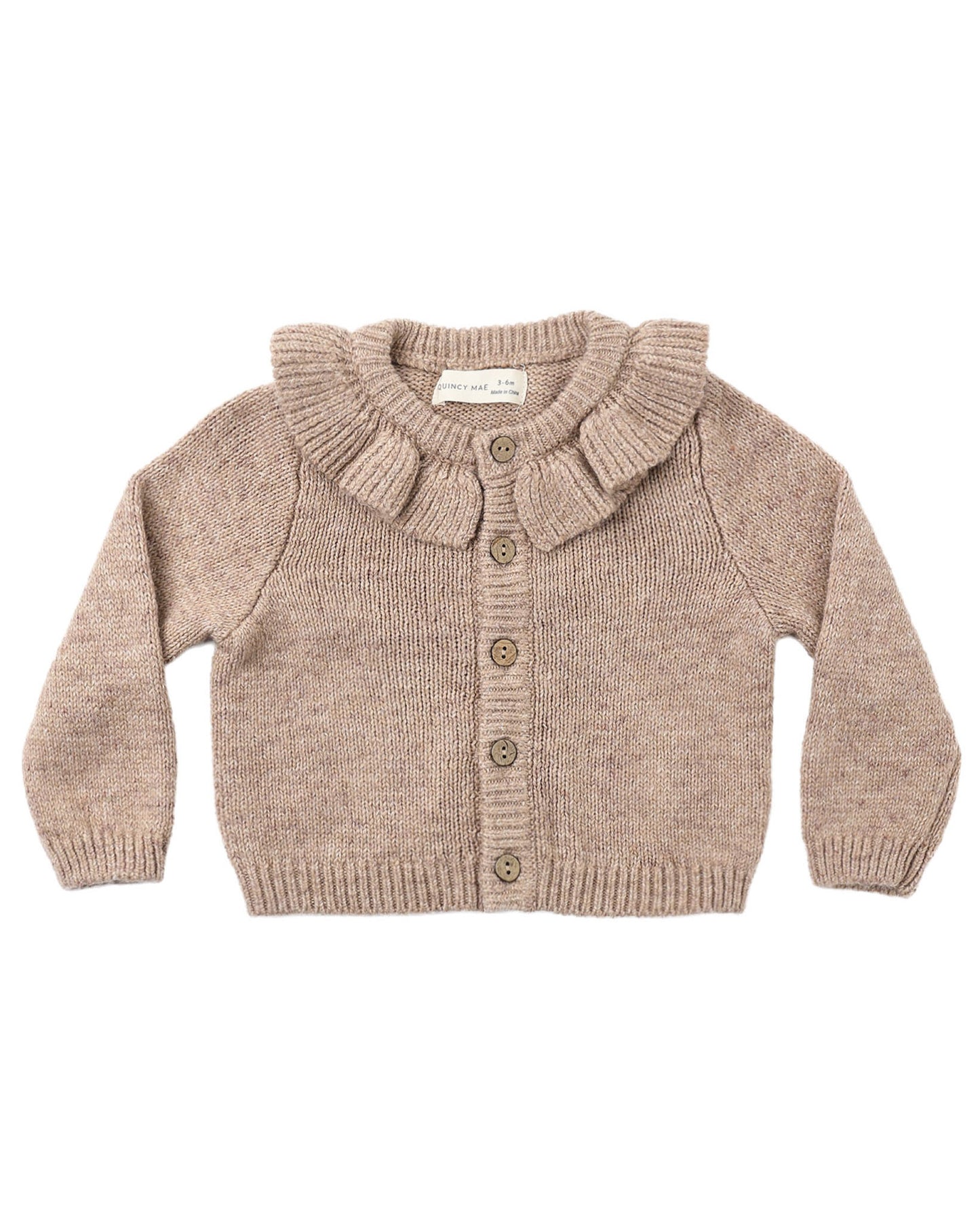 Knitted cardigan with ruffled collar on a white background