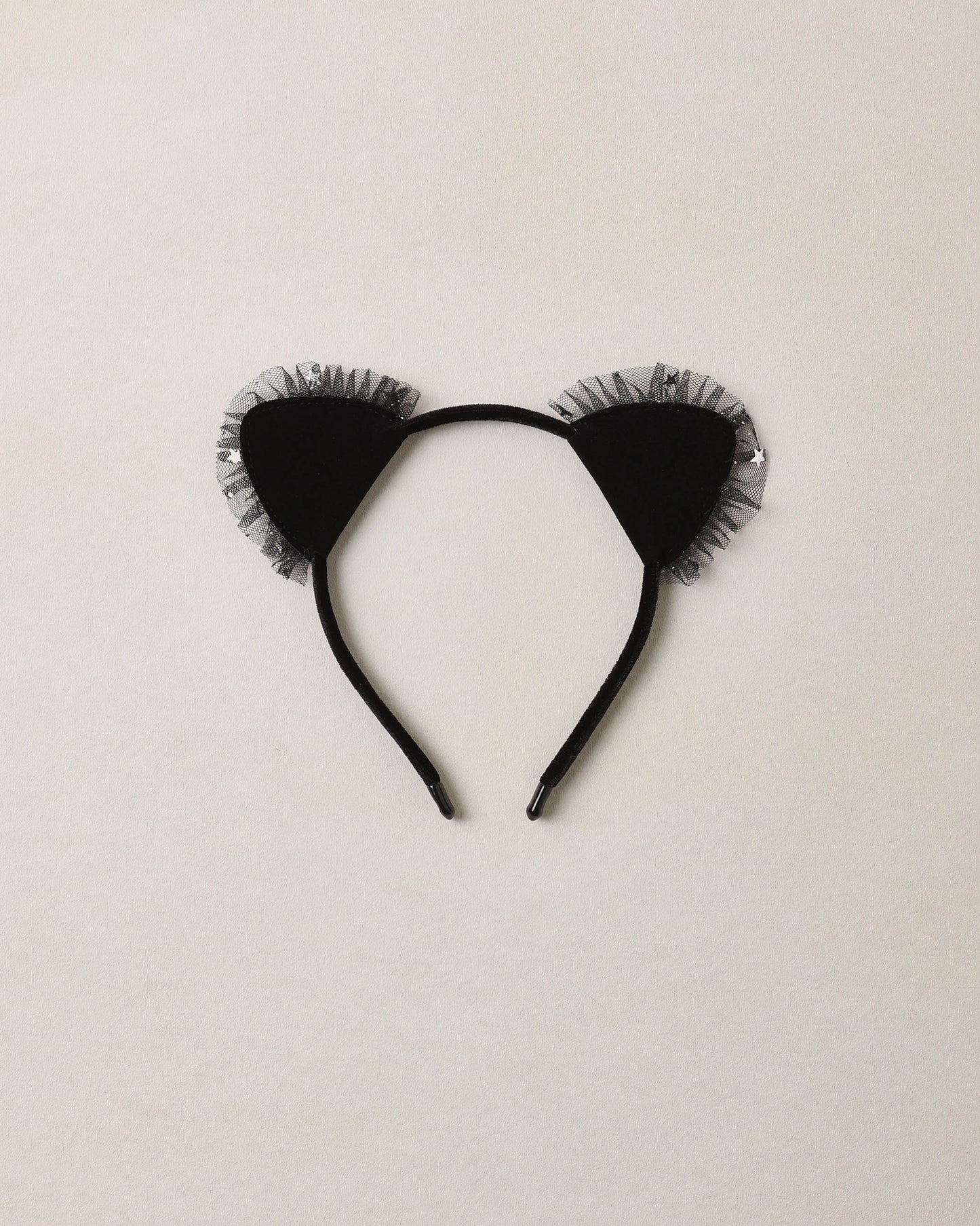 Cat headband in black on beige background