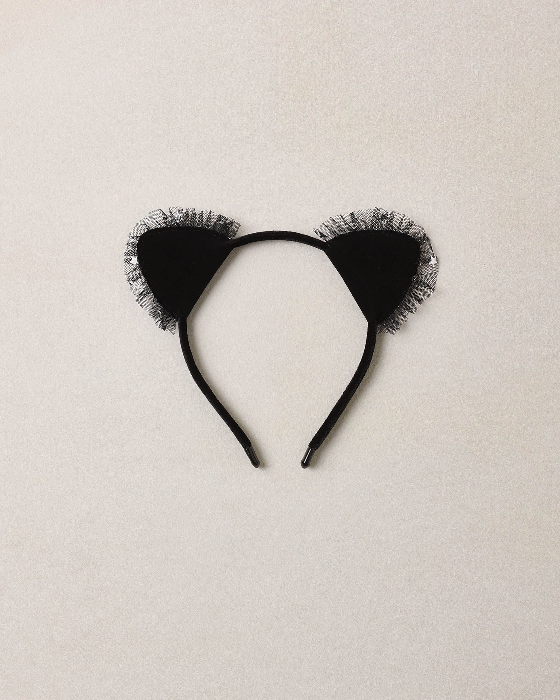 Cat headband in black on beige background