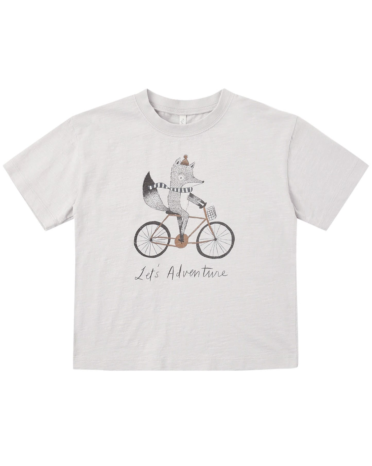 White t-shirt with a graphic of a fox riding a bicycle and 'Life is an Adventure' text on a white background.