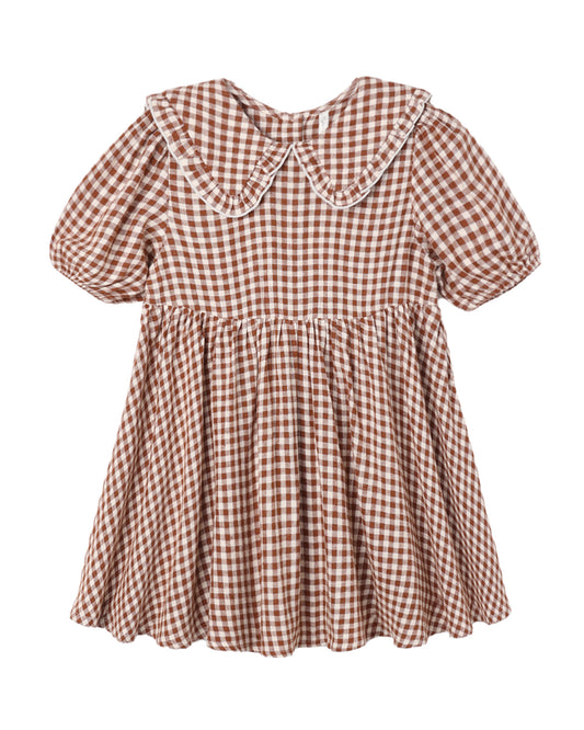 A short-sleeve gingham dress with a large Peter Pan collar, featuring a brown and white checkered pattern with white piped trim, shown against a plain white background.