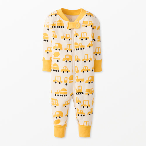Baby zippered onesie with yellow vehicle pattern on a white background
