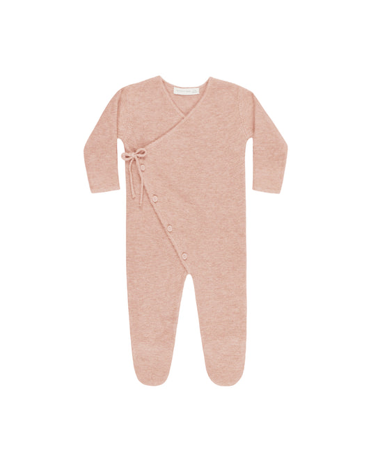 Pink baby onesie with buttons on a white background